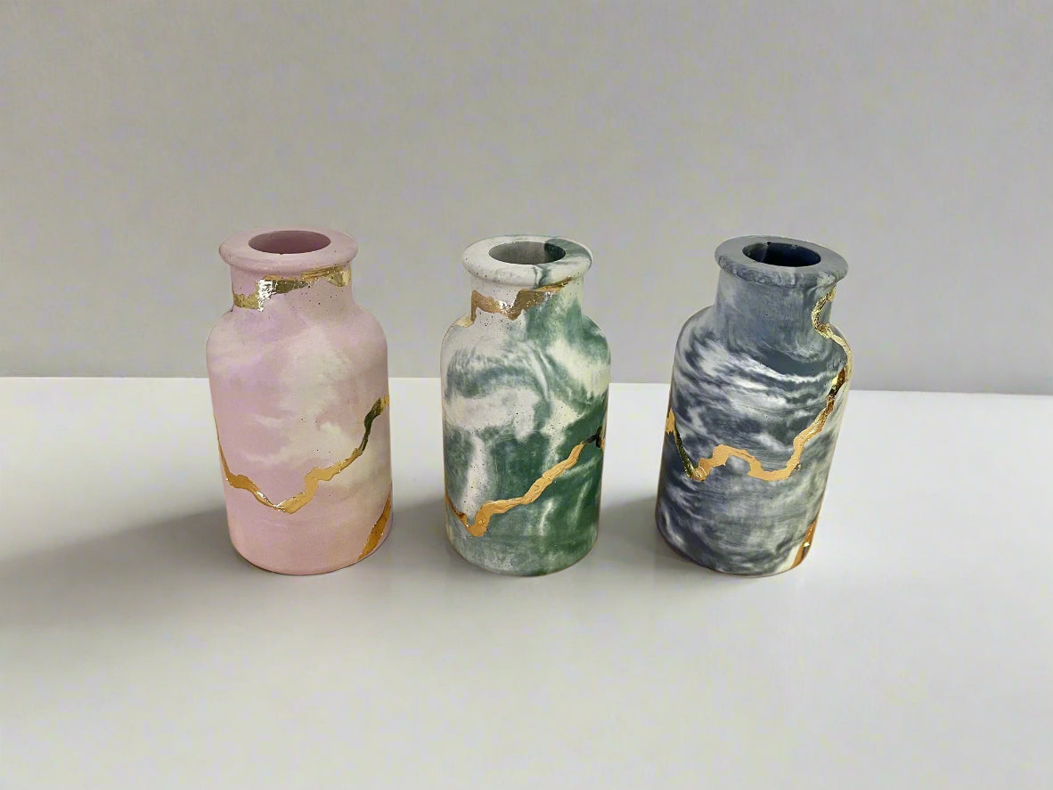 Cement smooth vase in marbled dark blue with gold details