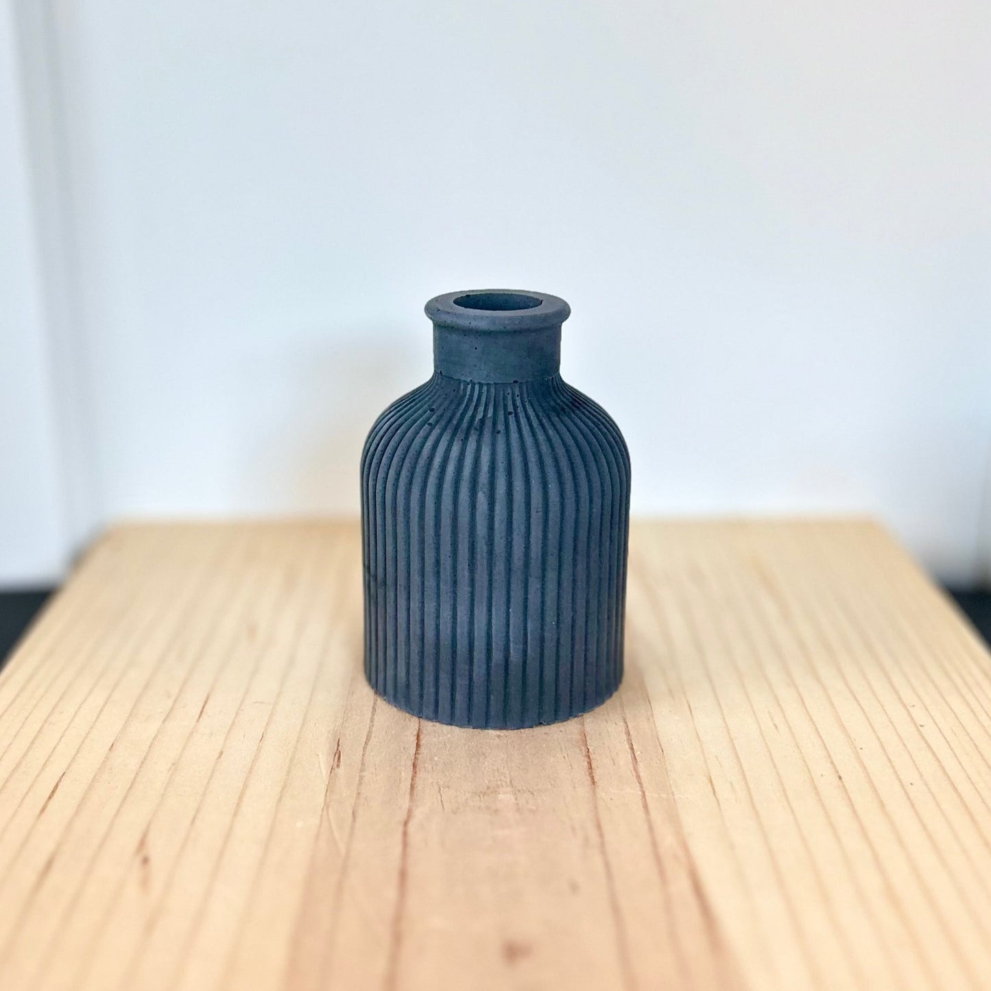 Concrete striped vase in solid black. Love Nene concrete home accessories and decor.