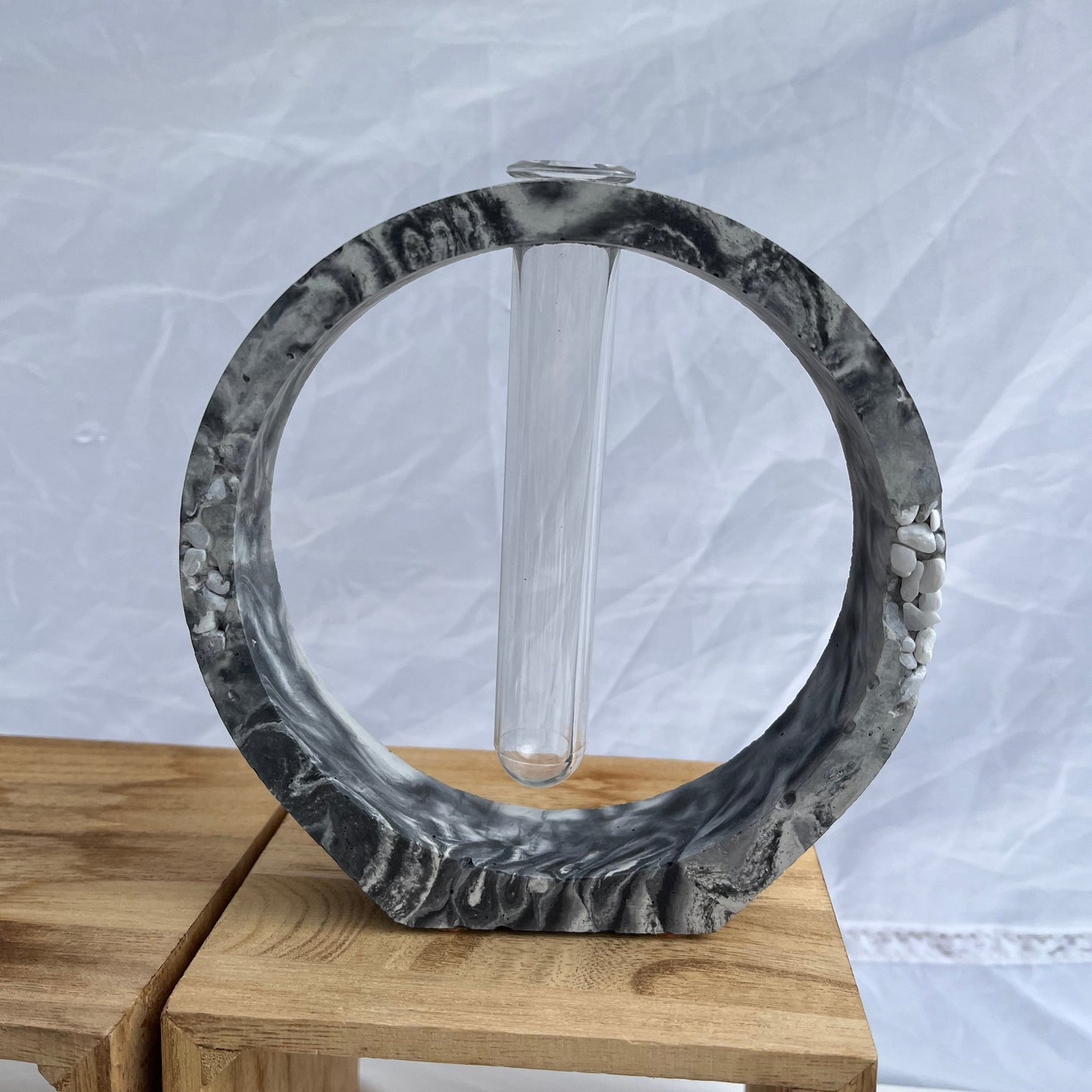 Round Propagation Station in marbled black with stone details.