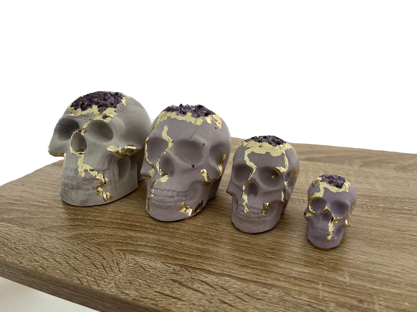 Halloween skulls 4 size options in purple with amethyst crystals. Love Nene Halloween Decor.