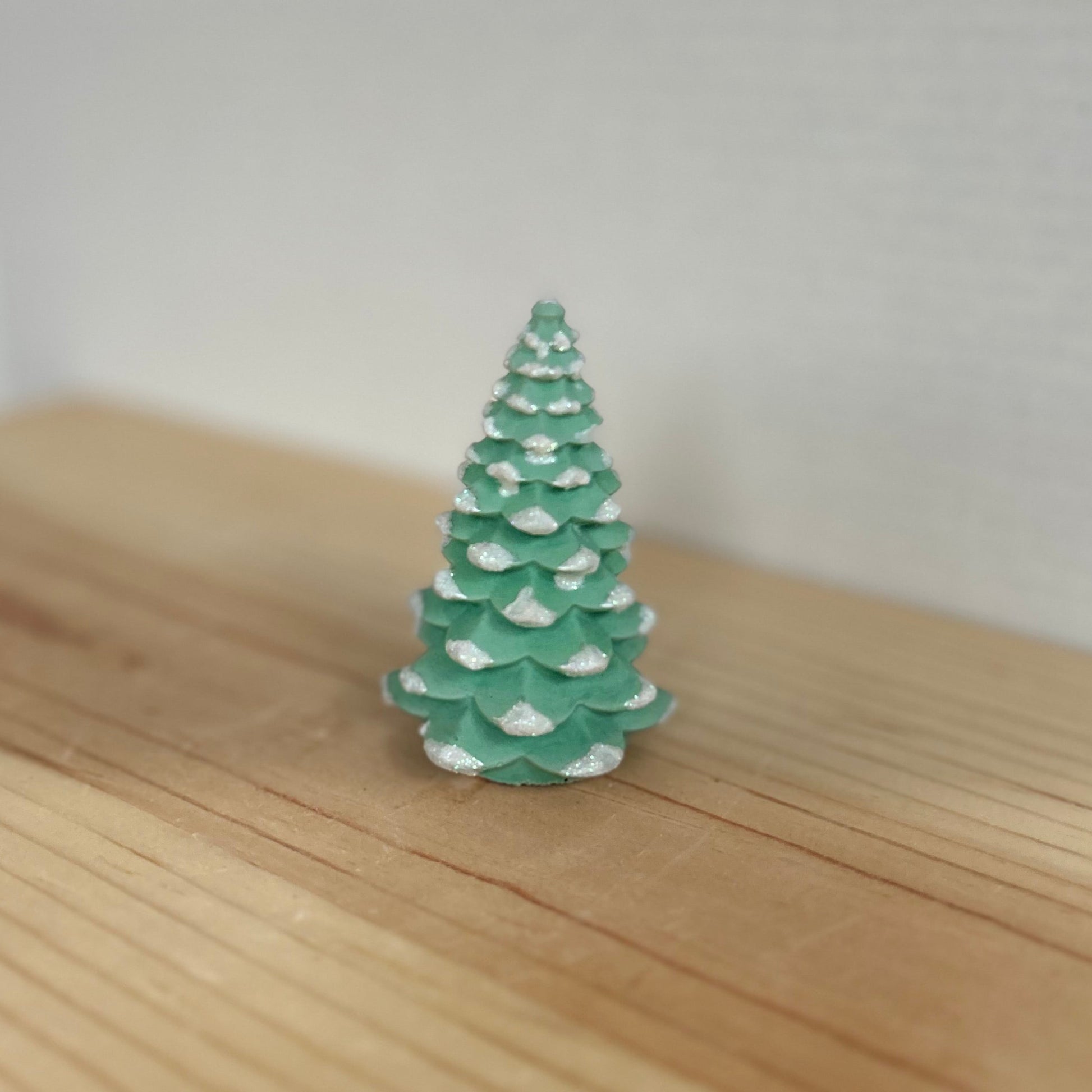 Norway Spruce small concrete Christmas tree in green with snow details. Xmas Tree Decor by Love Nene.