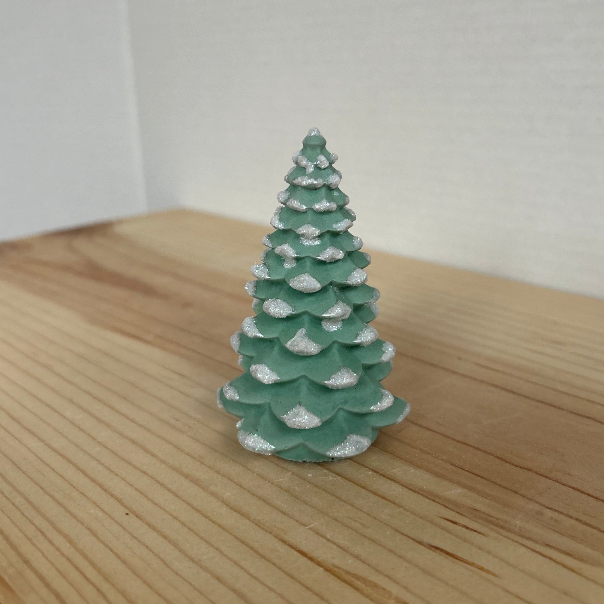 Norway Spruce small concrete Christmas tree in green with snow details. Xmas Tree Decor by Love Nene.