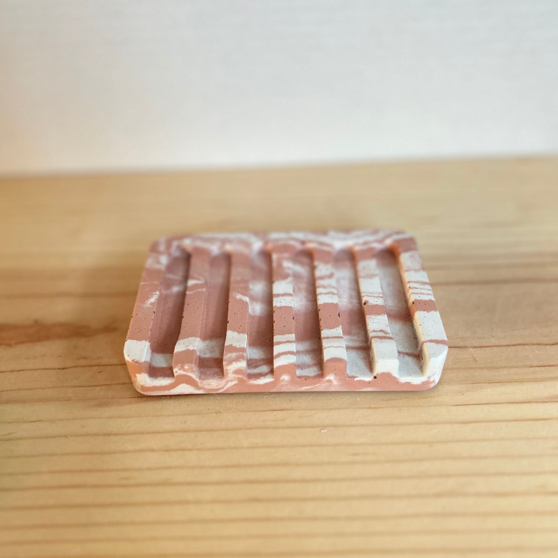 Concrete Soap Dish with Angled Drainage in marbled dusty terracotta. Sponge holders and soap dishes by Love Nene. 