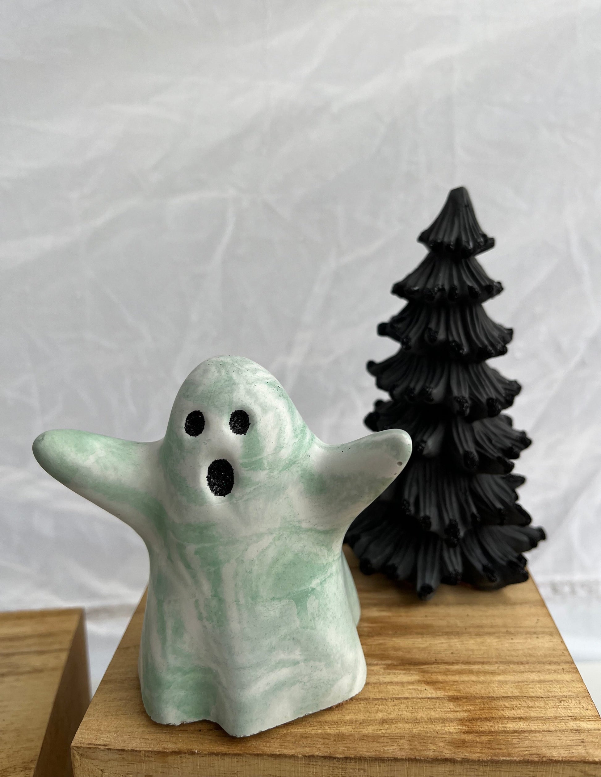 Halloween Ghost Figurine green and white marbled with Black Eyes.